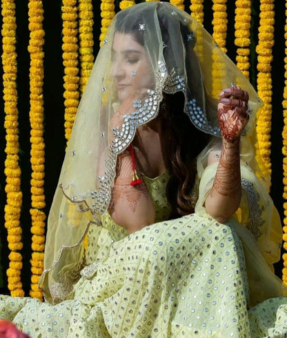 Light yellow georgette embroidered sequence work ceremonial lehenga choli