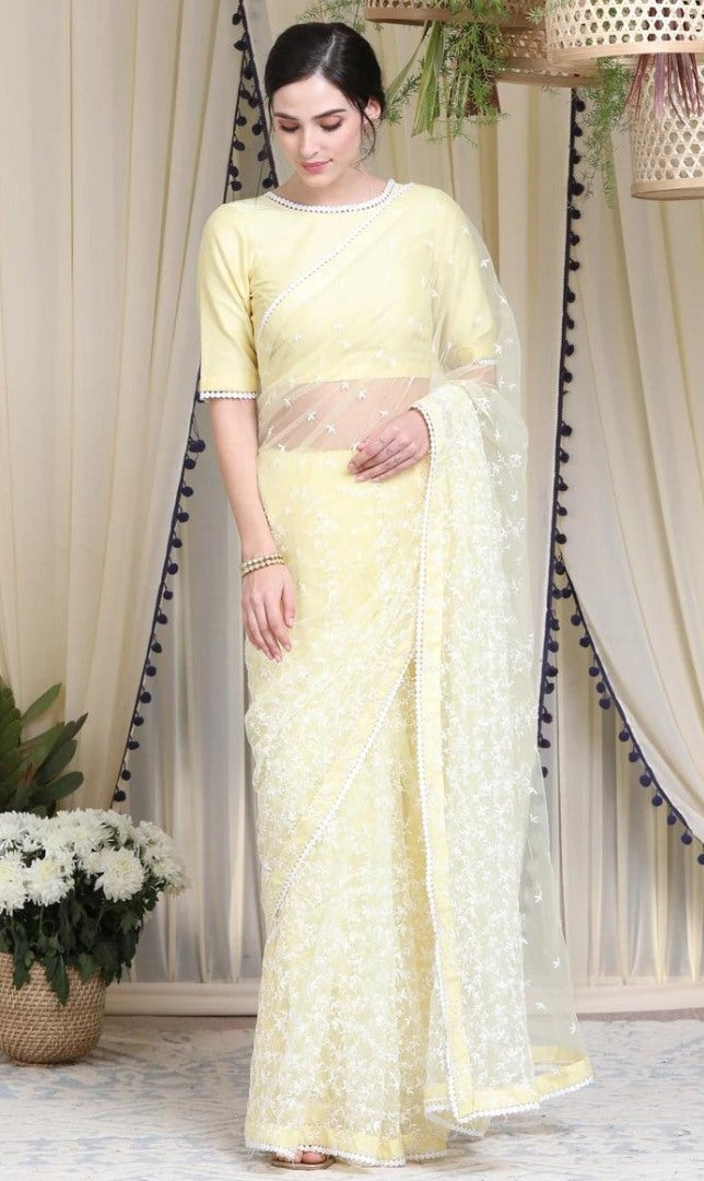 Light yellow heavy soft net thread work elegant look saree