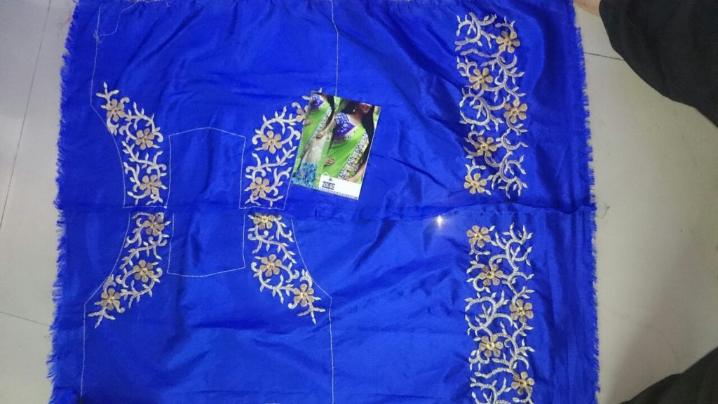 Mahaveer Designer embroidered green and cream saree