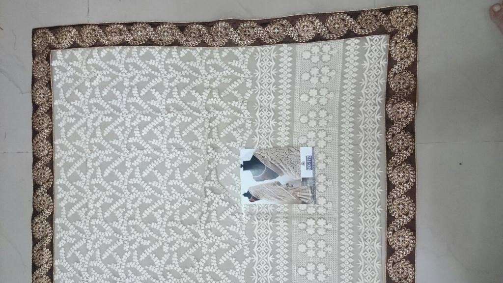 Mahaveer designer embroidered cream wedding saree