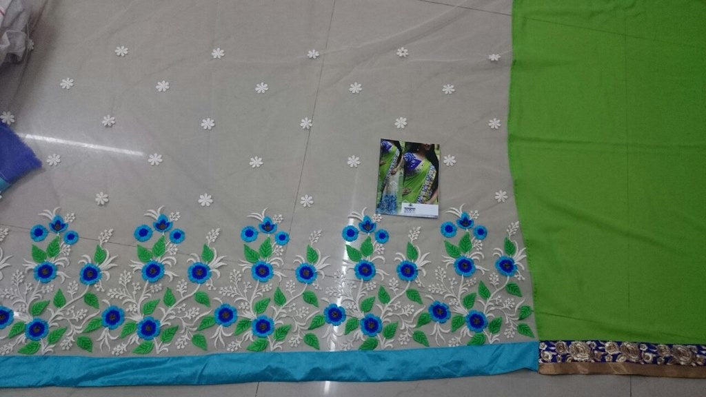 Mahaveer Designer embroidered green and cream saree