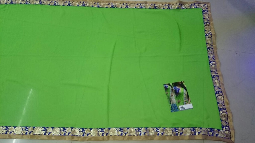 Mahaveer Designer embroidered green and cream saree