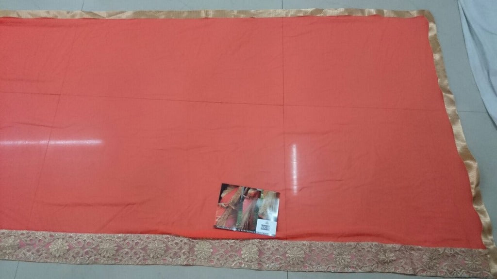 Mahaveer Designer embroidered orange and cream half half saree