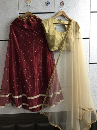 maroon net festival wear lehenga