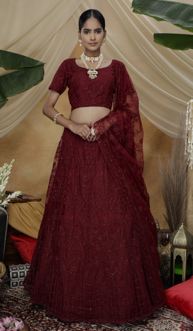 Maroon net heavy embroidered s wedding lehenga choli with koti