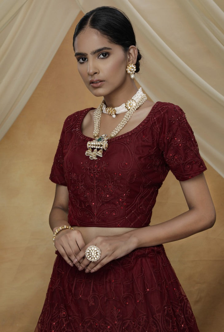 Maroon net heavy embroidered s wedding lehenga choli with koti