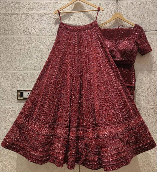Maroon net heavy sequence and dori work embroidered bridal lehenga choli