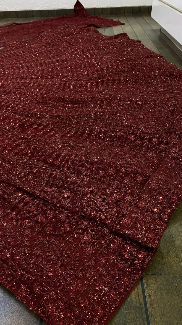 Maroon net heavy sequence and dori work embroidered bridal lehenga choli