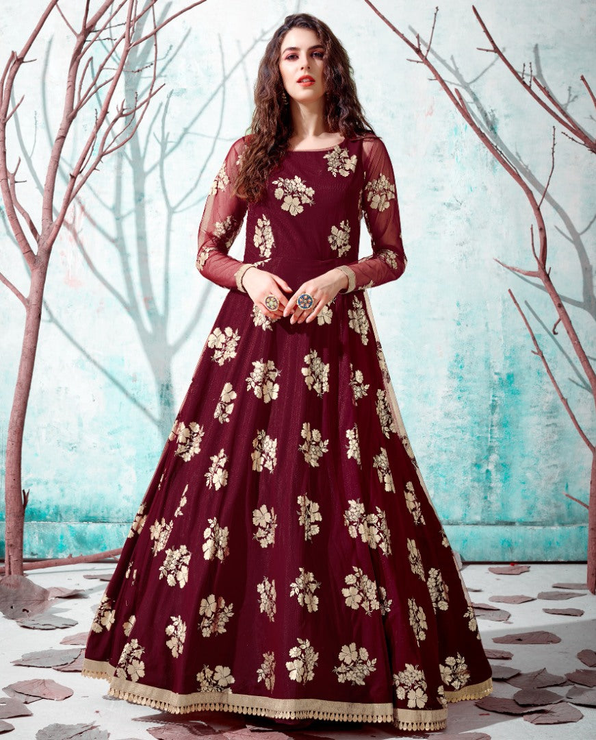 Maroon net metallic foil work party wear designer gown