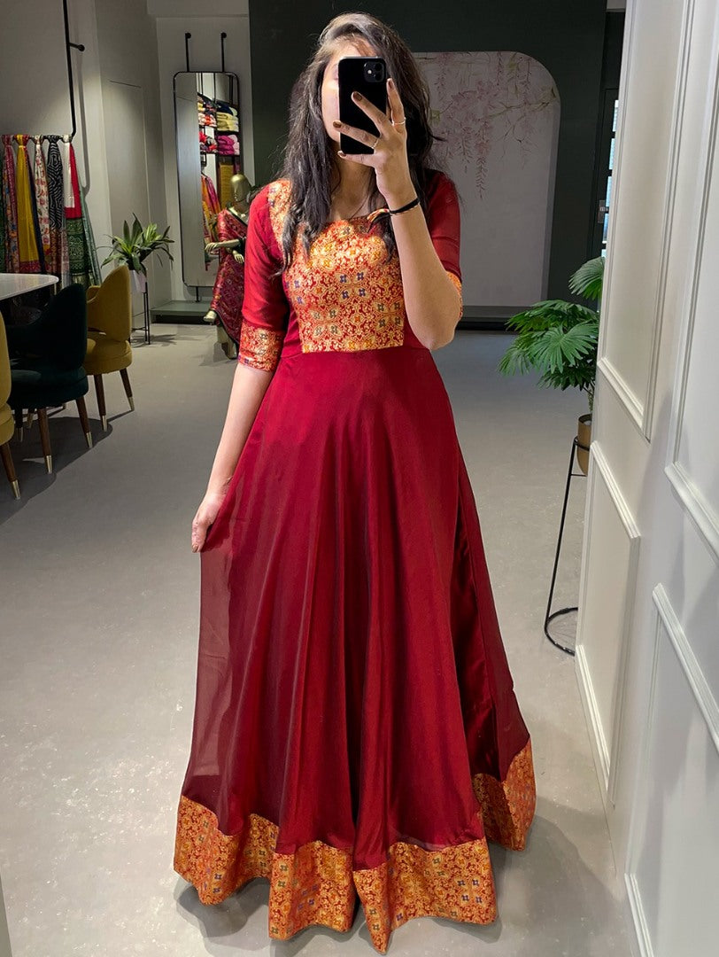 Maroon rangoli silk weaving work gown