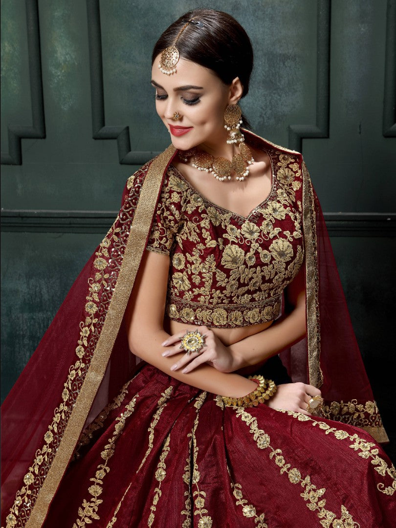 Maroon raw silk heavy dori and sequence work wedding lehenga