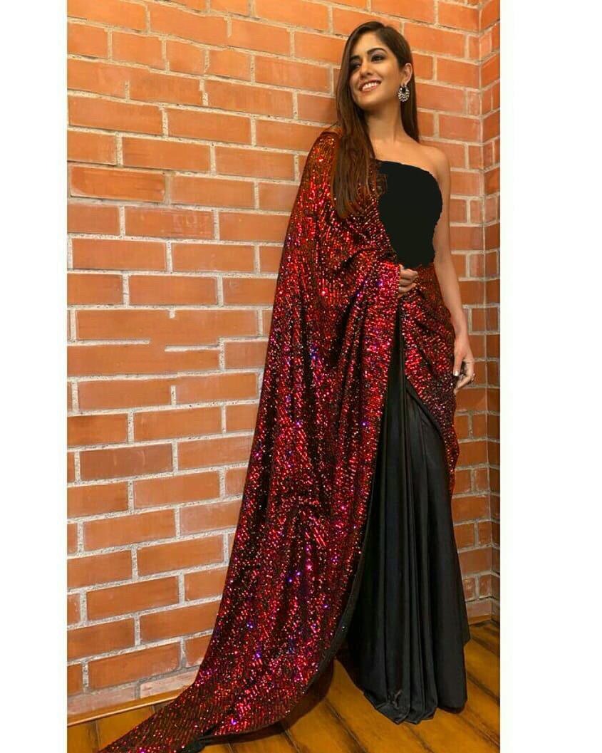 Maroon sequence work and black half half glamorous saree