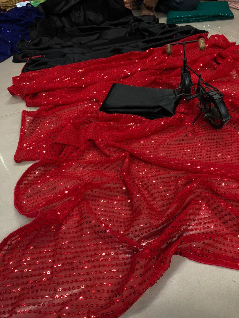 Maroon sequence work and black half half glamorous saree