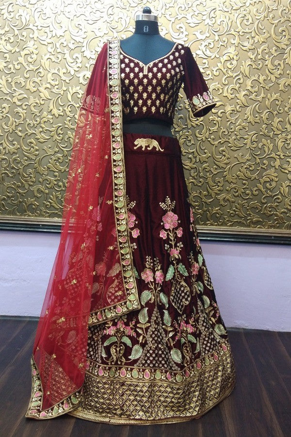 Maroon velvet designer heavy embroidered bridal lehenga