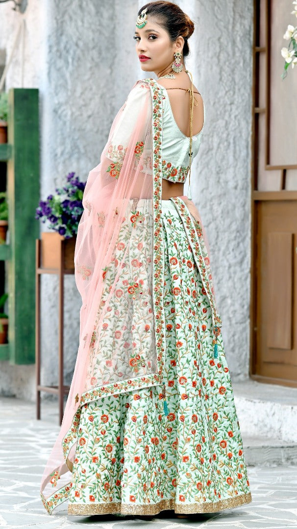 Mint green silk heavy multi thread embroidery worked wedding lehenga