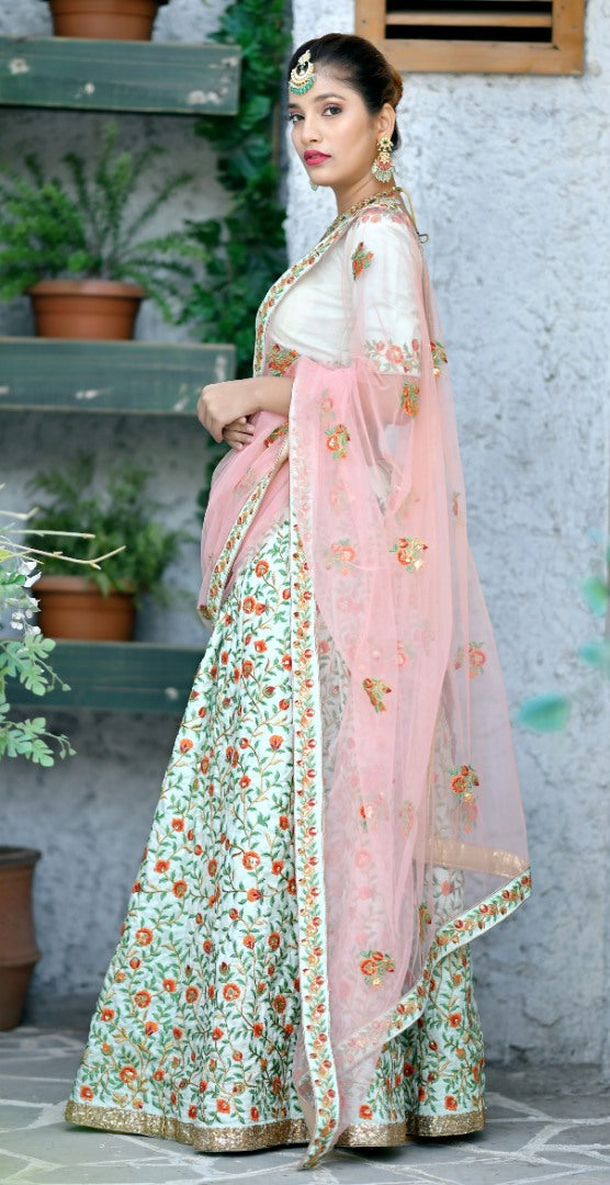 Mint green silk heavy multi thread embroidery worked wedding lehenga
