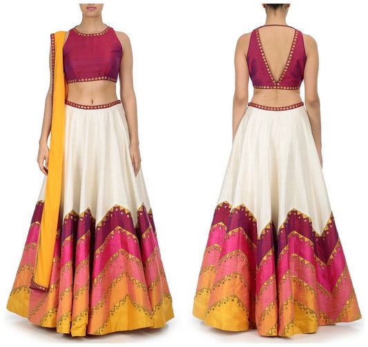 Multi colored lehenga with pink embroidered blouse and dupatta.