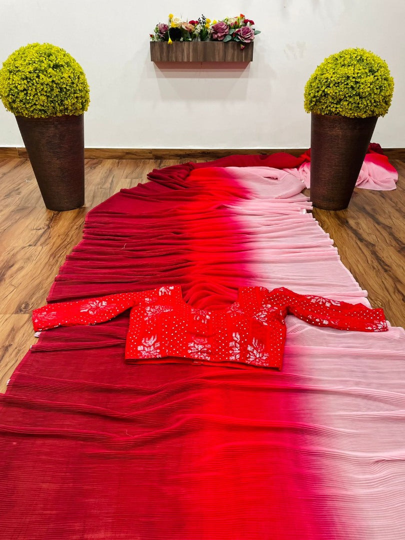 Multi shade red georgette pleated saree with heavy blouse