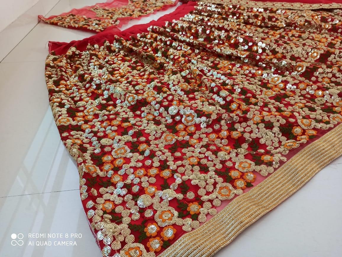 Multicolored thread embroidered net sequence work wedding lehenga choli