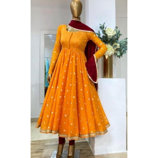 Mustard yellow heavy georgette embroidered party wear gown