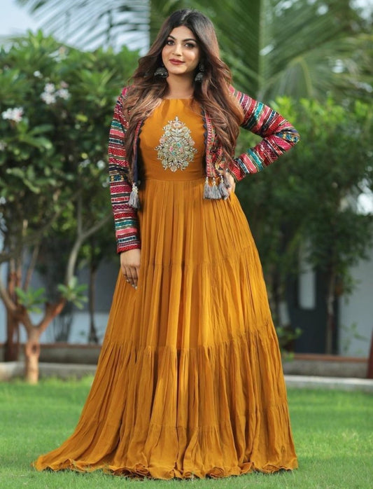 Musturd yellow georgette gown with heavy embroidered cotti