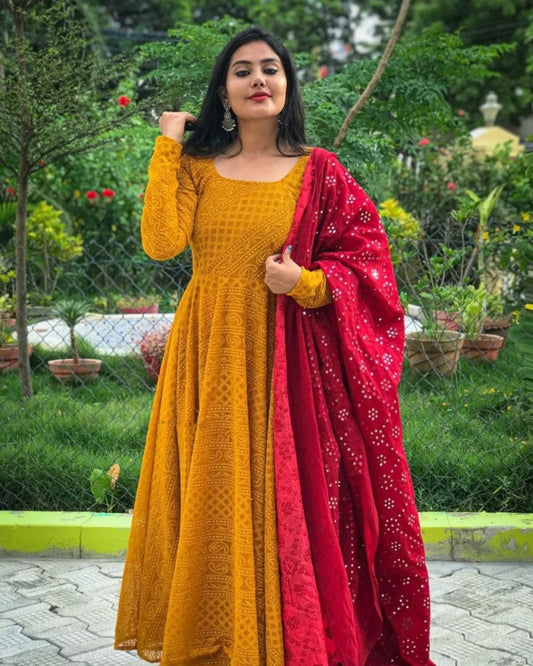 Musturd yellow heavy chikankari work gown