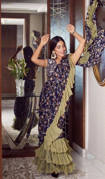 Navy blue floral printed georgette saree with green ruffle border