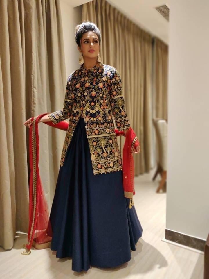 navy blue tapeta silk lehenga with heavy embroidered long choli