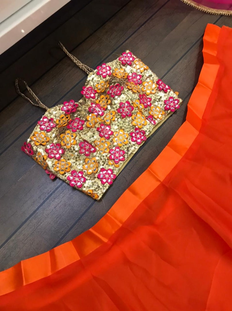 Orange ceremonial lehenga choli with heavy work blouse