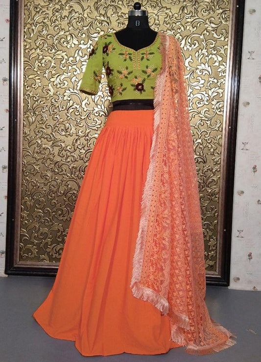 Orange crape lehenga with peach heavy threadwork dupatta