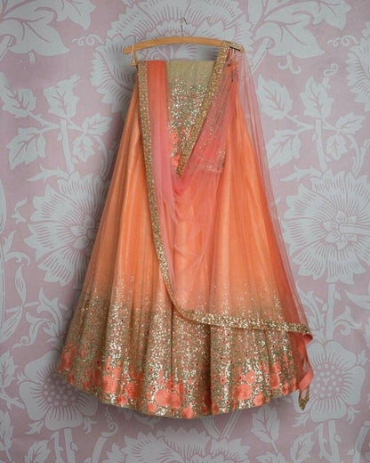 Orange net embroidered sequence wedding lehenga