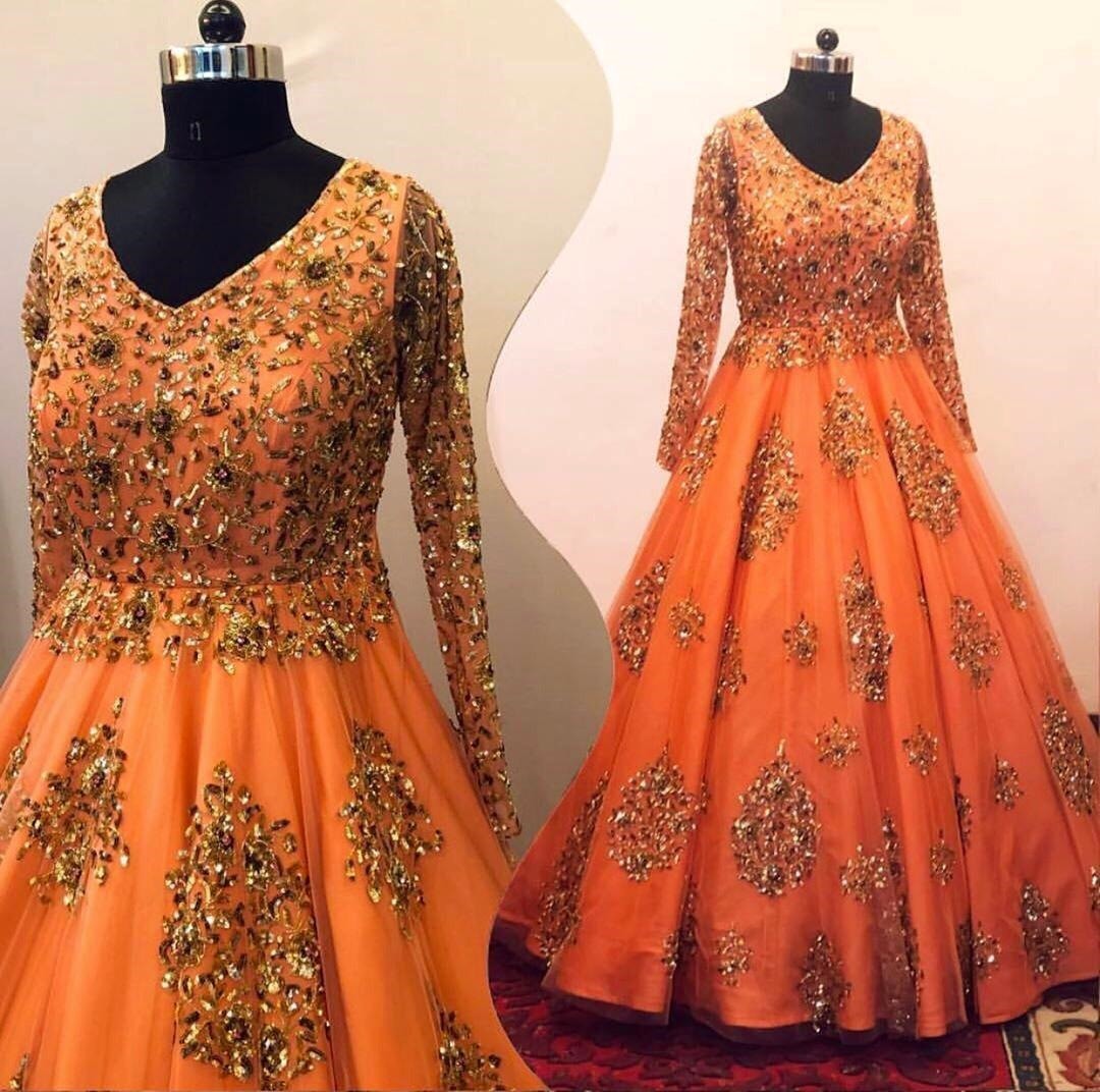 Orange net heavy sequence work wedding gown