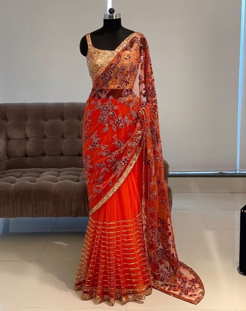 Orange net thread embroidered saree