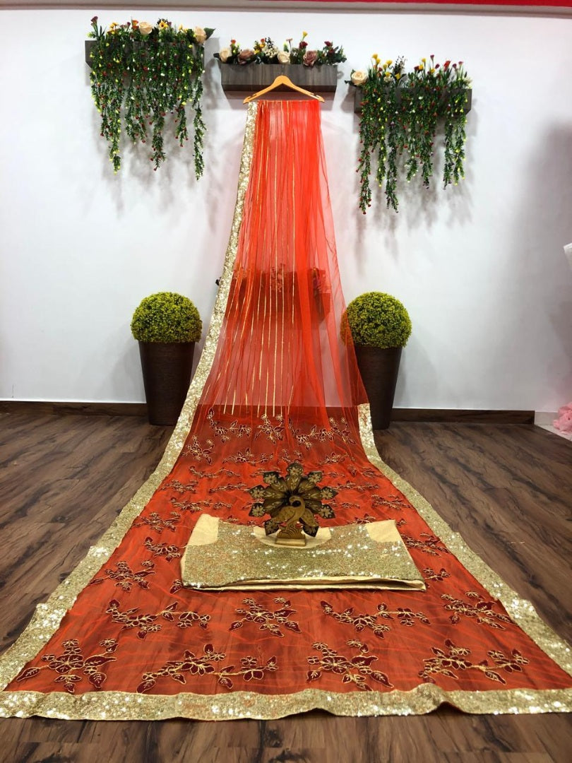 Orange net thread embroidered saree