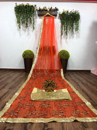 Orange net thread embroidered saree