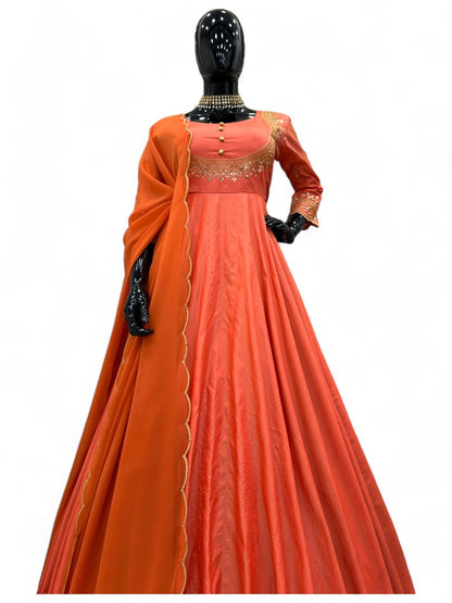 Orange party wear silk gown