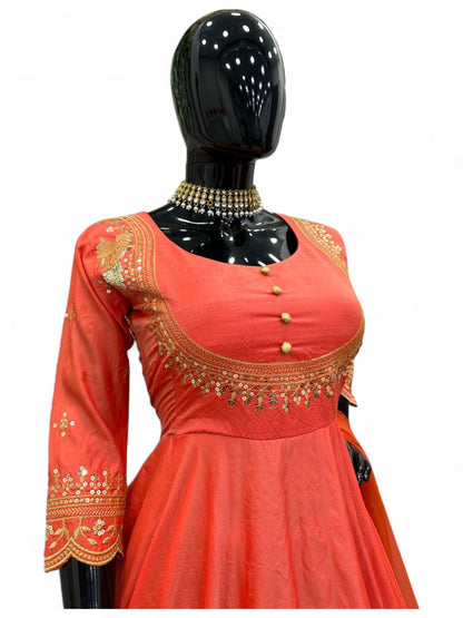 Orange party wear silk gown