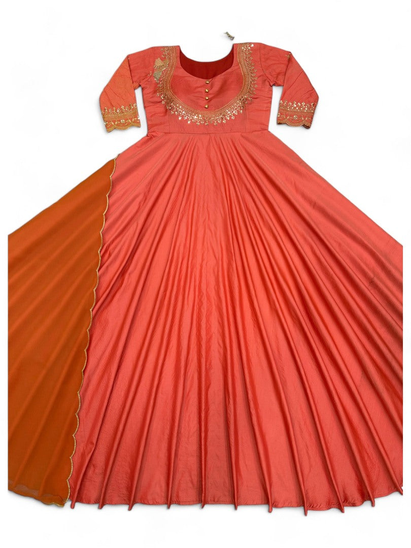 Orange party wear silk gown