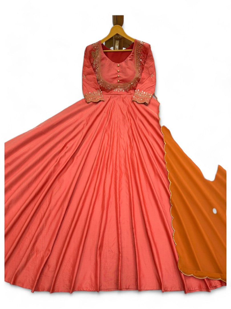 Orange party wear silk gown