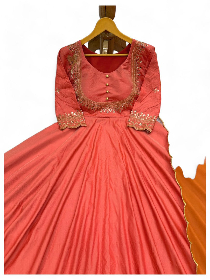 Orange party wear silk gown