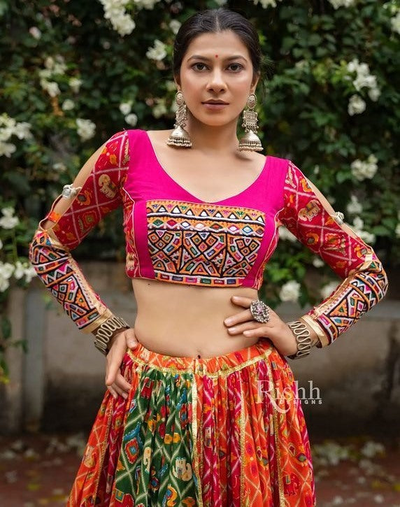 Orange pink print and mirror work gujarati garba navratri lehenga chaniya choli