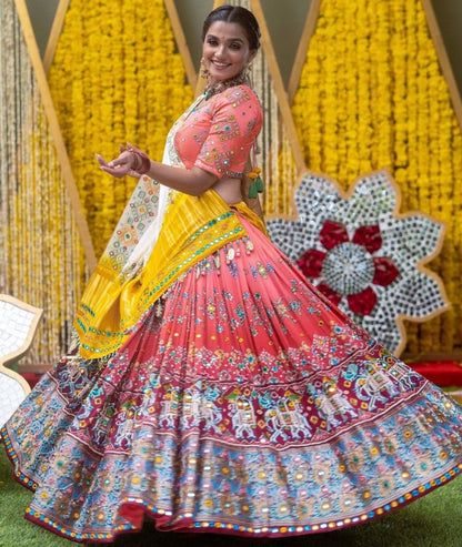 Orange print and mirror work gujarati garba navratri lehenga chaniya choli