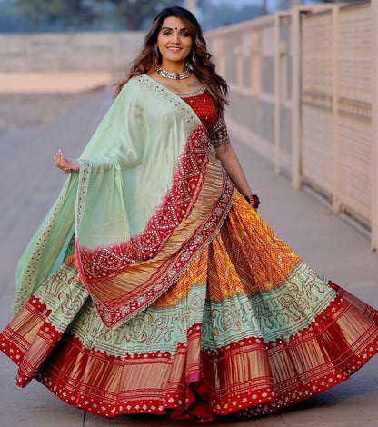 Orange print and mirror work gujarati garba navratri lehenga chaniya choli