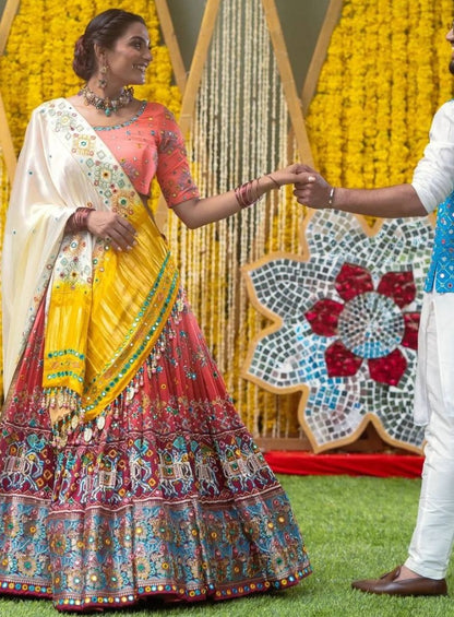 Orange print and mirror work gujarati garba navratri lehenga chaniya choli