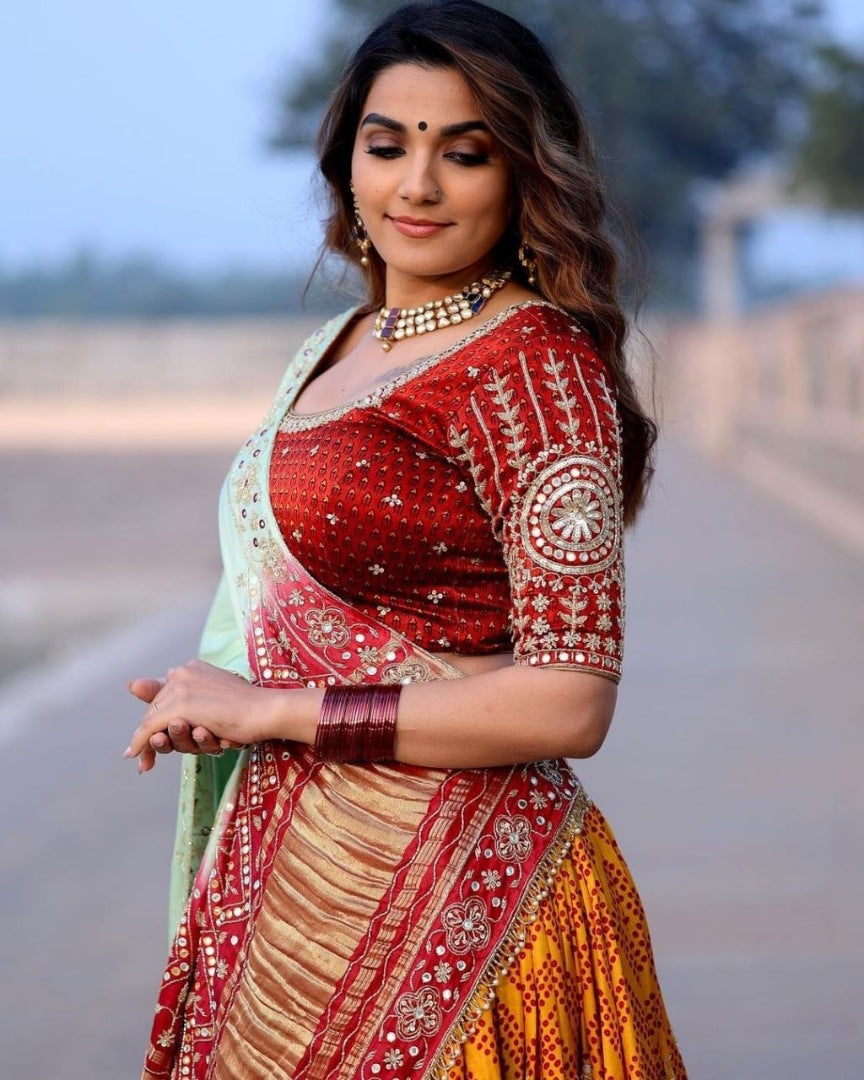 Orange print and mirror work gujarati garba navratri lehenga chaniya choli