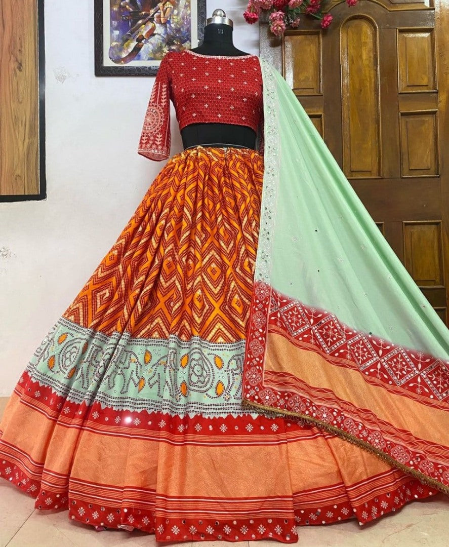 Orange print and mirror work gujarati garba navratri lehenga chaniya choli