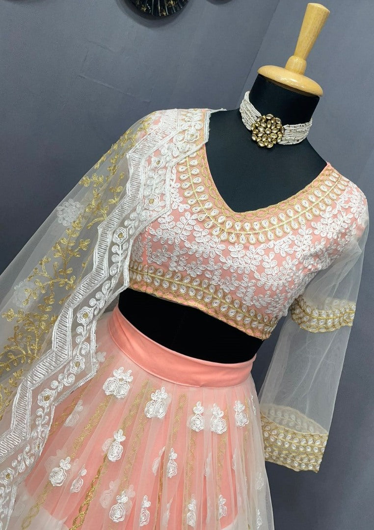Peach and white soft net heavy embroidered lehenga choli