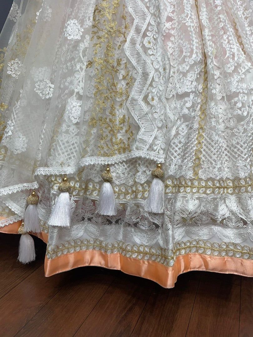 Peach and white soft net heavy embroidered lehenga choli