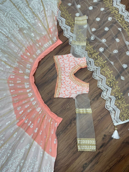 Peach and white soft net heavy embroidered lehenga choli