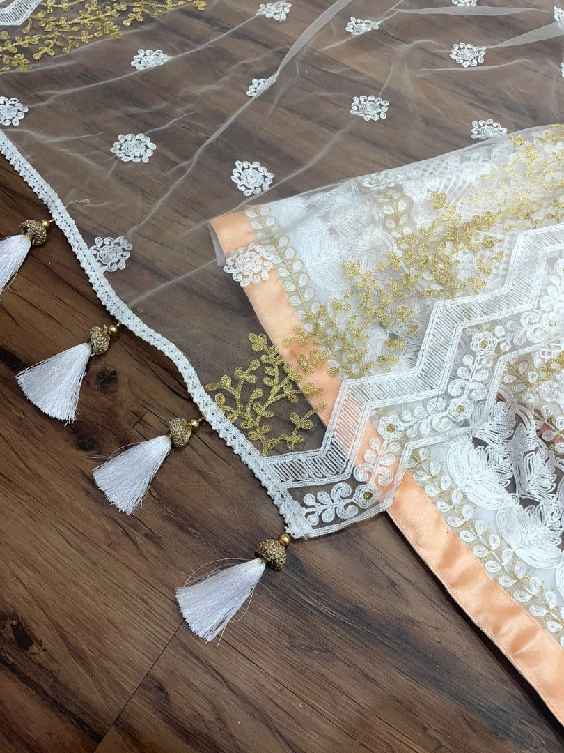 Peach and white soft net heavy embroidered lehenga choli